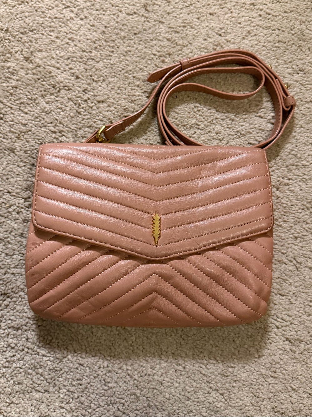 Thacker New York Jenna Quilted Leather Crossbody Bag arrow gold logo